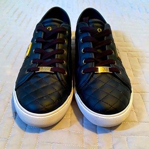 Guess women’s casual shoe; black with gold
